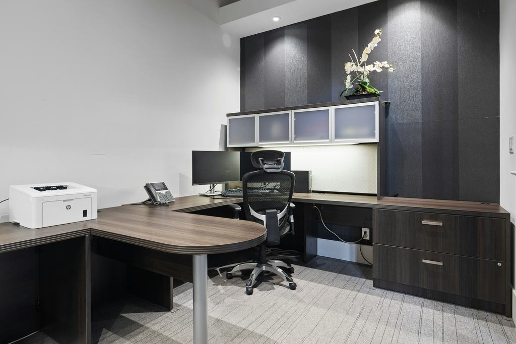 Small office with a desk and built-in cabinets