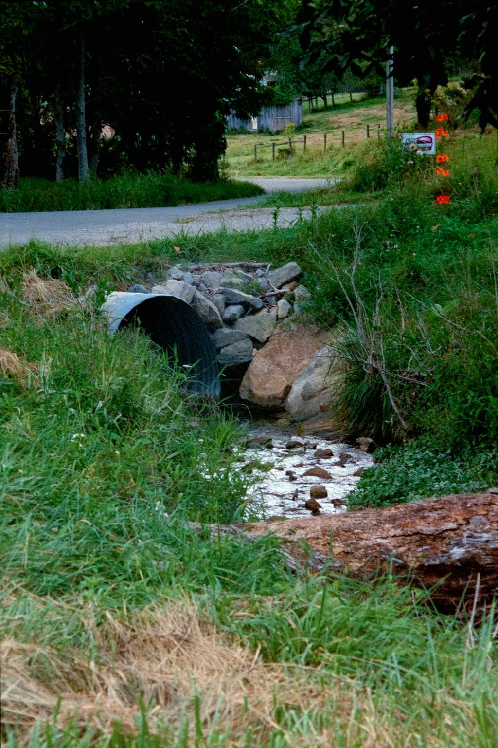 Drainage culvert outlet lined with stone riprap