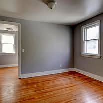 Freshly painted room with a hardwood floor