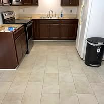 Kitchen with dark wood cabinets and a tile floor