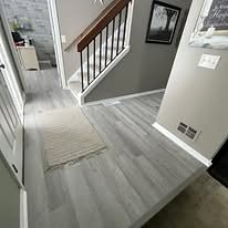 Entry and staircase with vinyl plank flooring