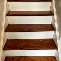 Staircase with stained wood treads and white risers